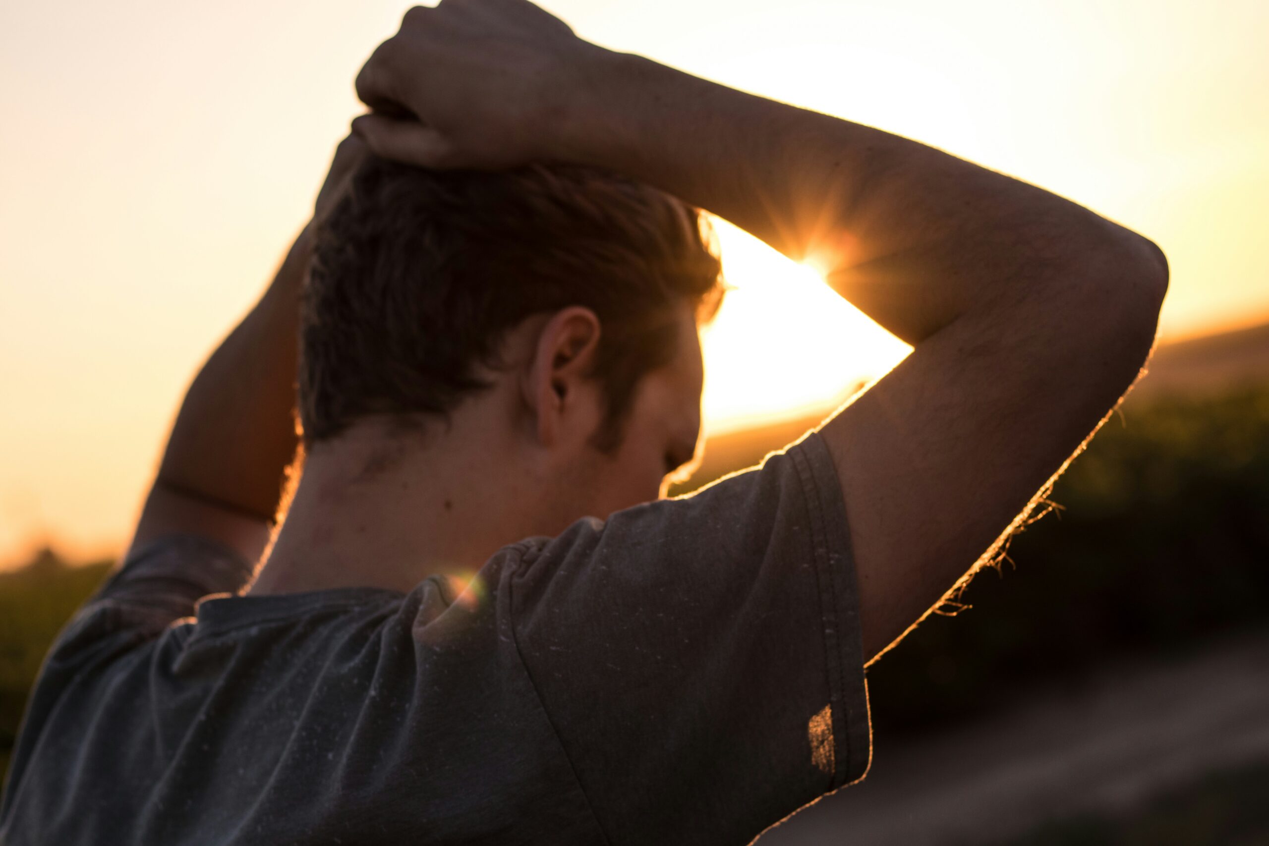 man People Images & Pictures hopeless wellness united states thinking pose despair laton men golden hour faceless caucasian hand up sun flare resting rest hand sunshine hiker hike HD Wallpapers